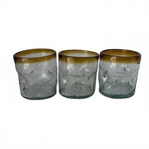 Set of three 3” tall hand-blown Mexican glass tumblers with amber rims.